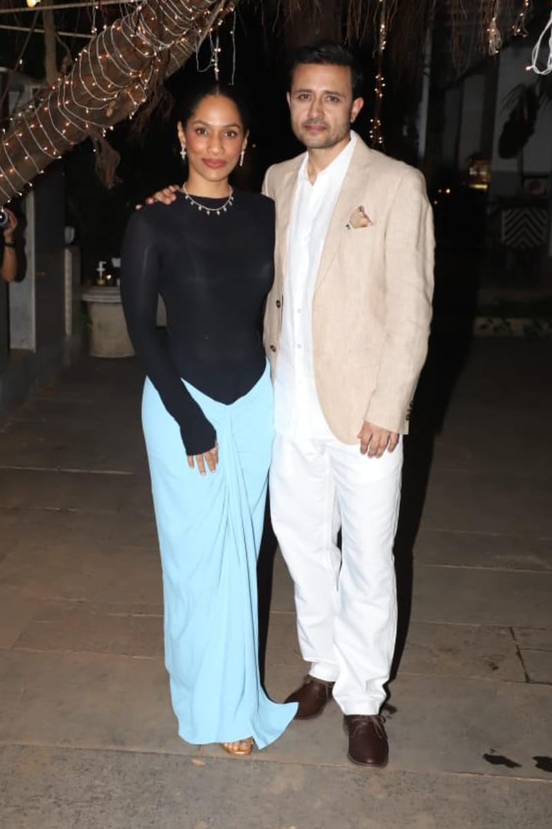Newly-weds, Masaba Gupta and Satyadeep Misra looked picture-perfect as they posed for the paps. Renowned for her class-apart sartorial choices, the newly-married bride turned heads as she ditched an extravagant outfit for chic yet comfy party wear, which consisted of a stylish sky-blue skirt and a body-hugging black full-sleeve top. 